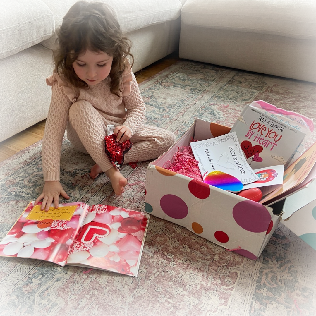 young girl reading book from bookpal friends subscription book box